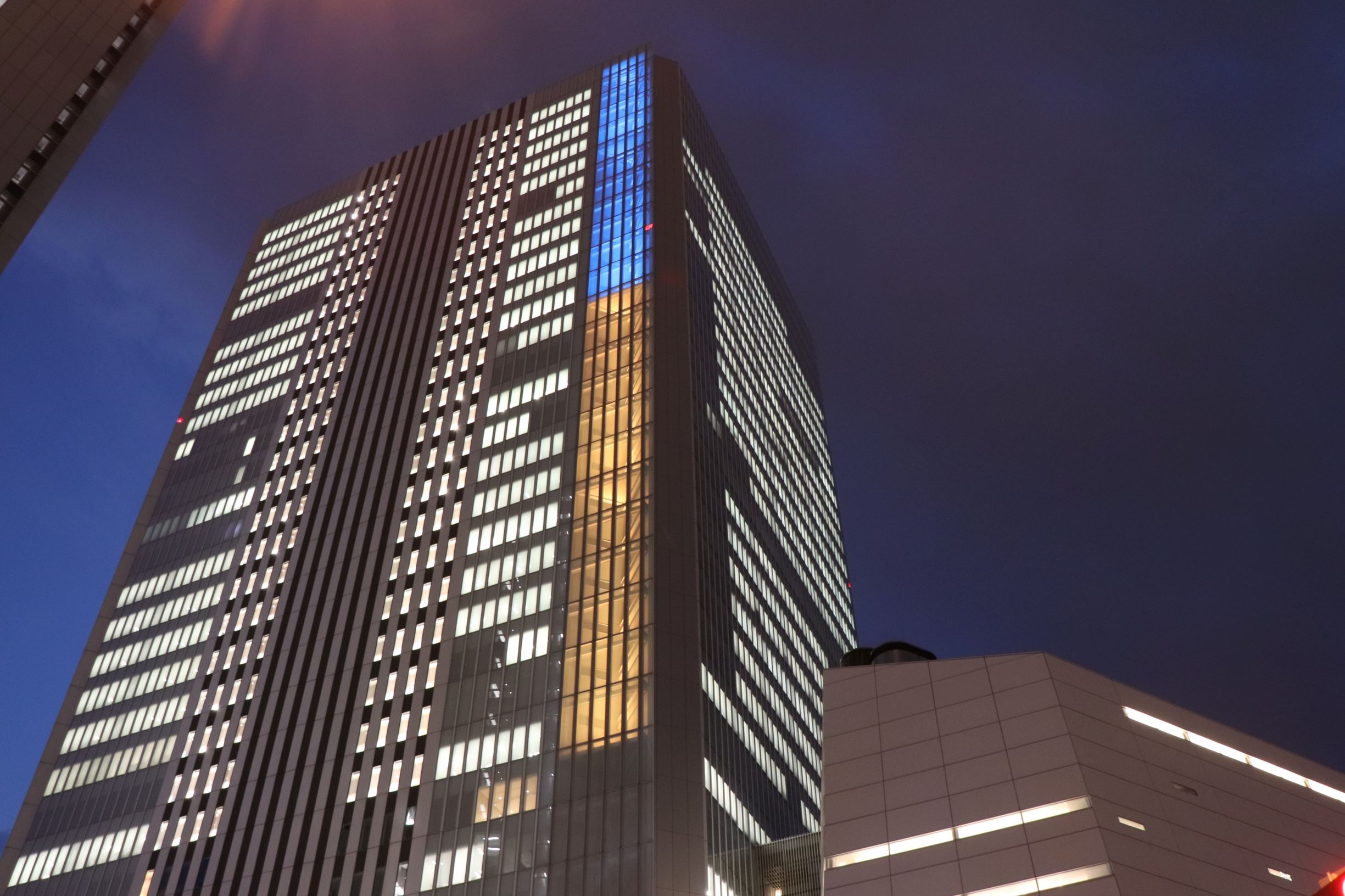 Yokohama City Hall illuminated in the colors of the Ukrainian flag