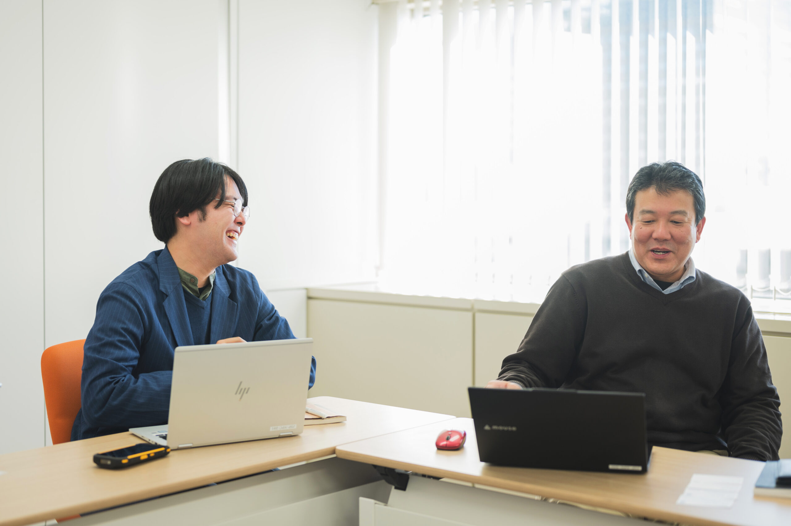 Mr. Takahiro Iwata and Mr. Wataru Nozawa, laughing at JSP, a Yokohama-based company