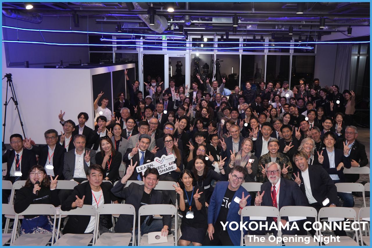 Group of people from Japan and the rest of the world smiling, captioned Yokohama Connect,  the opening night